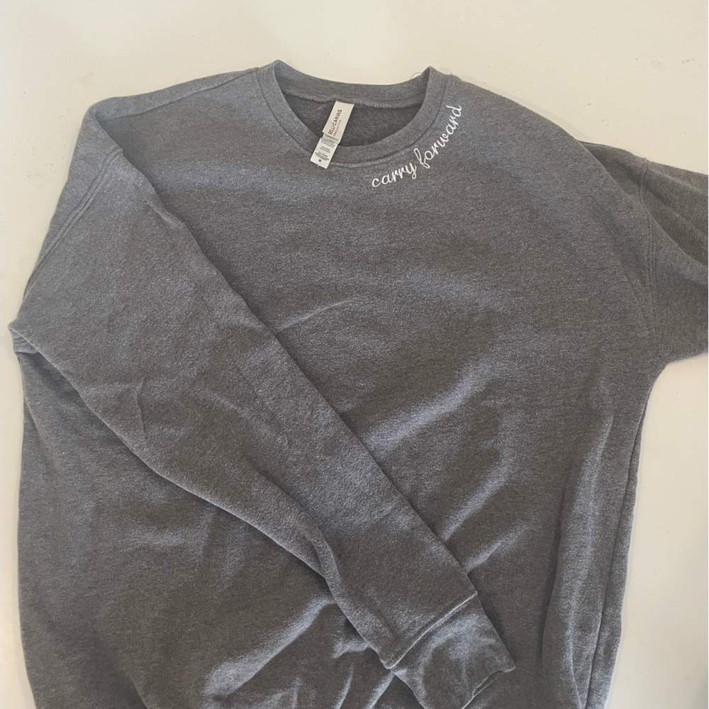 Gray crew neck with carry forward on the neck line from Bella and Canvas.